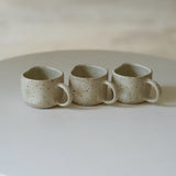 Kaloka x Kafe de Flores Sand Titan Series handmade ceramic cup in sand bone, artisanal stoneware Indonesia.