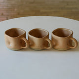 Kaloka x Kafe de Flores Twinkle Series handmade ceramic cup in latte, artisanal stoneware Indonesia.